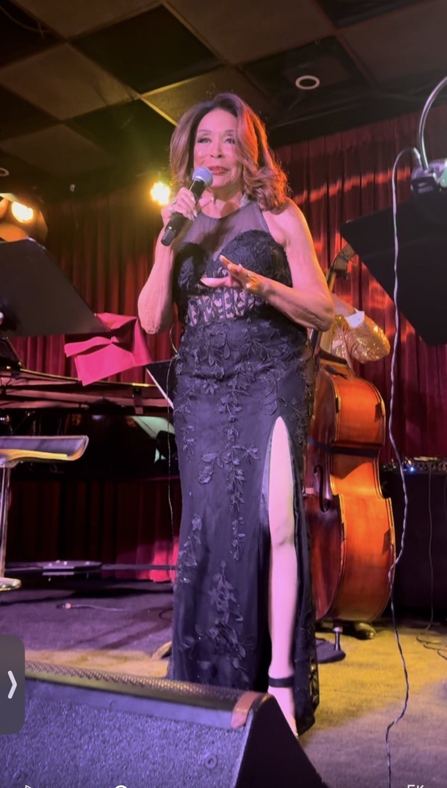 Freda Payne in a floor-length black lace gown on stage